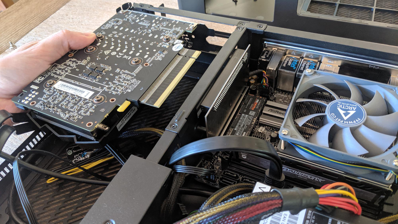 Many small form factor builds use PCIe risers to put your graphics card in a separate chamber.